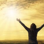 woman, sky, sunlight, nature, arms, open arms, sunbeams, sunrays, clouds, worship, freedom, happiness, relieved, prayer, praise, success, joy